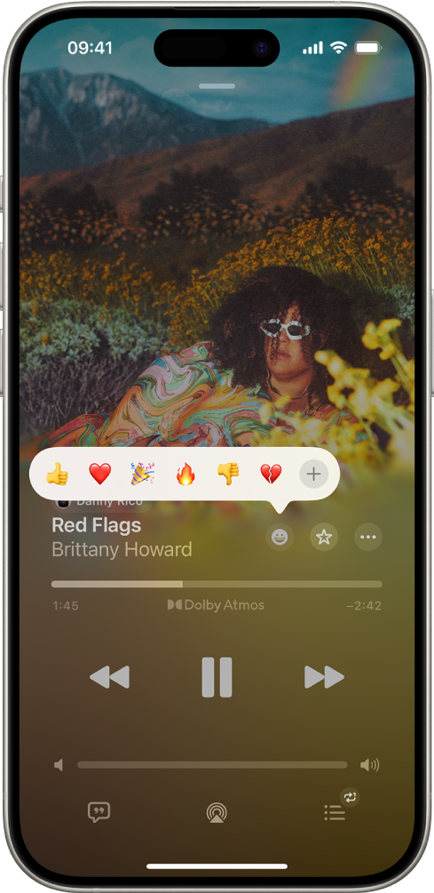 La schermata “In riproduzione” con il pulsante delle reazioni con diverse emoji e il pulsante Aggiungi che può essere selezionato per trovare altre emoji.