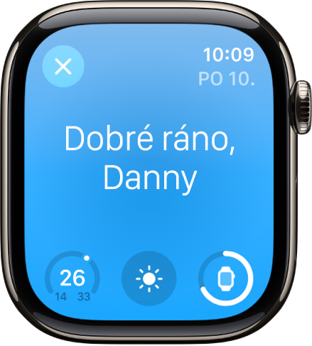 Apple Watch s úvodní obrazovkou po probuzení. Nahoře se zobrazují slova „Dobré ráno“. Pod ním je uvedena teplota, povětrnostní podmínky a úroveň nabití baterie.