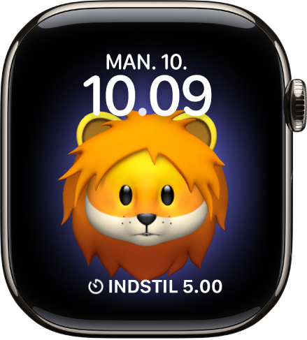 Urskiven Memoji, hvor du kan justere Memoji-figuren, og en komplikation forneden. Tryk på skærmen for at animere Memoji. Dato og tid vises foroven, og komplikationen Tidtagning er forneden.
