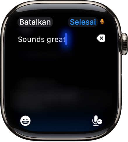 Layar bidang teks yang menampilkan pesan yang dibuat dengan dikte. Tombol Emoji dan Dikte berada di bagian bawah layar.