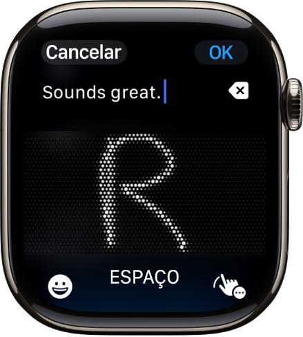 O ecrã do campo de texto a mostrar uma letra escrita com a funcionalidade Escrever à mão. Na parte inferior do ecrã estão os botões “Emoji” e “Escrever à mão”.