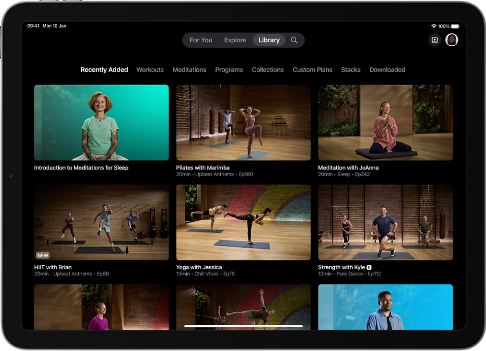 The Library screen in Apple Fitness+ showing workouts, meditations and programmes. A row of categories is at the top of the screen.