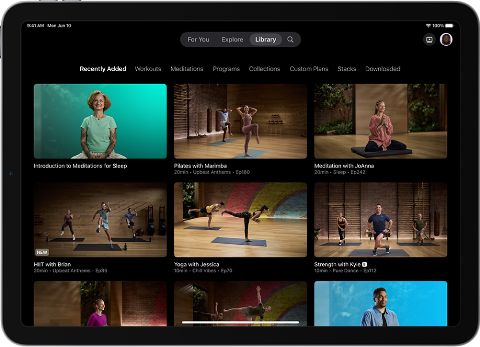 The Library screen in Apple Fitness+ showing workouts, meditations, and programs. A row of categories is at the top of the screen.