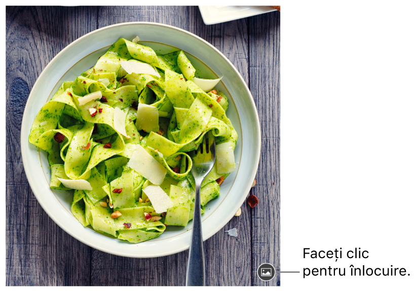 Imagine cu butonul Înlocuiți imaginea.