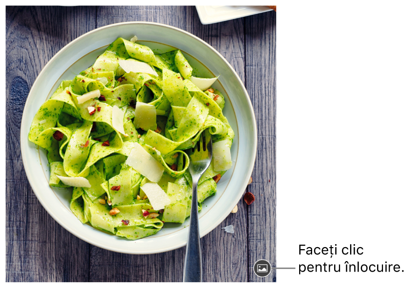 Imagine cu butonul Înlocuiți imaginea.