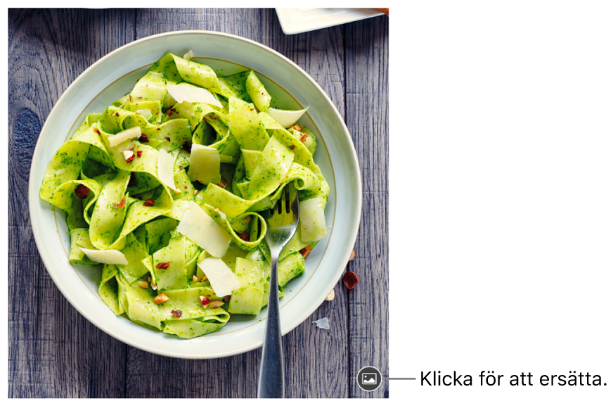 En bild med en knapp för att ersätta bild.