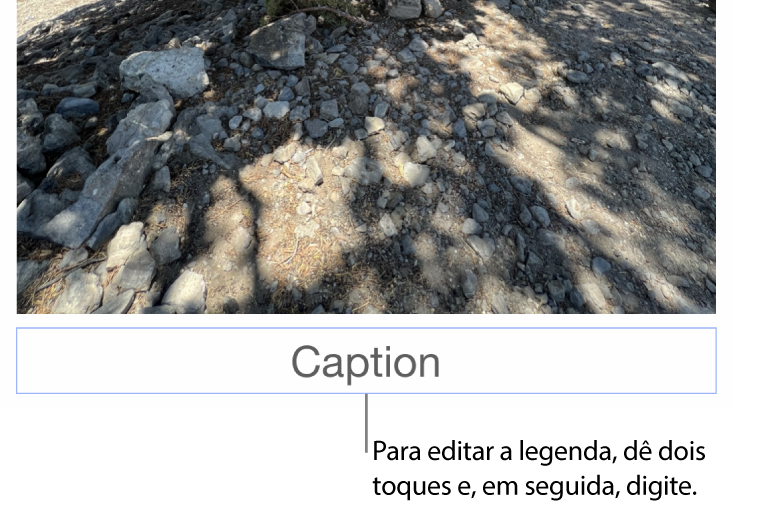 O marcador de posição de legenda, “Legenda”, aparece sob a fotografia; um contorno azul em redor do campo de legenda para mostrar que está selecionado.