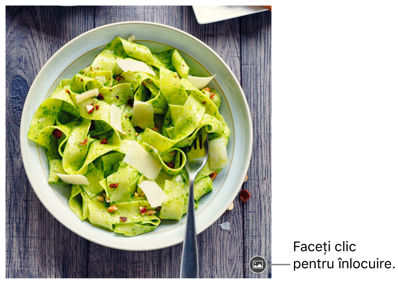 Imagine cu butonul Înlocuiți imaginea.