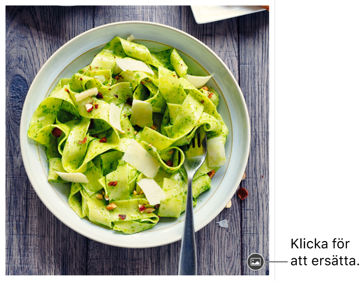 En bild med en knapp för att ersätta bild.