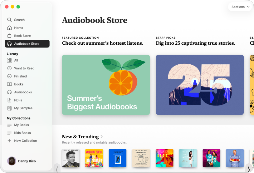 A Books app window showing the Audiobook Store selected in the sidebar, with categories of titles to the right including New & Trending.