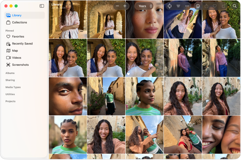 Das Fotos-Hauptfenster zeigt, dass „Mediathek“ links in der Seitenleiste ausgewählt ist. Die Fotos sind auf der rechten Seite in einem Raster sortiert und oben befindet sich die Symbolleiste.