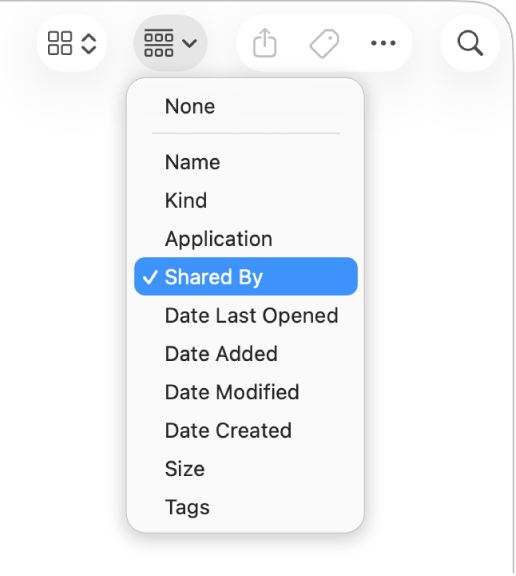 The group button in the Finder window toolbar with the group pop-up menu open and the Shared By option selected.