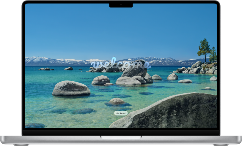 A Mac screen shows a desktop picture with a lake and mountains and a welcome message for users to get started using macOS Tahoe.