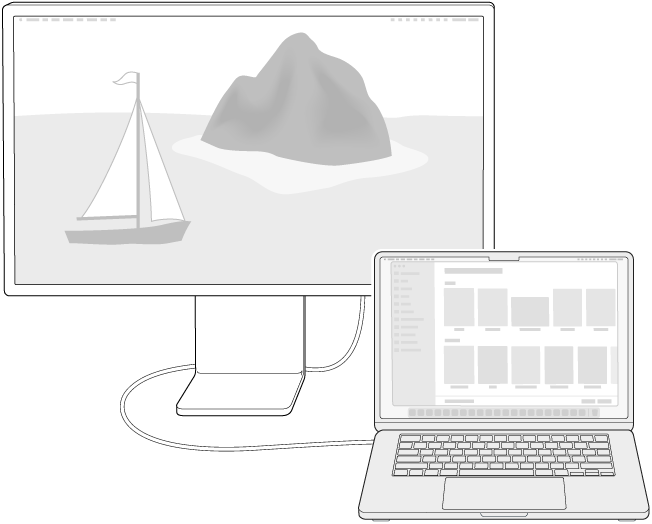 A display connected to a MacBook Air with the desktop extended across both screens.