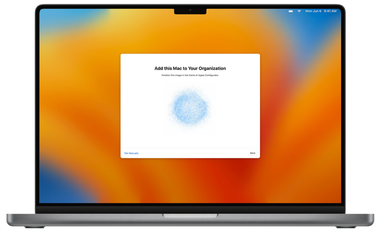 An image of a Mac laptop with Setup Assistant showing the image to pair with Apple School Manager or Apple Business Manager.