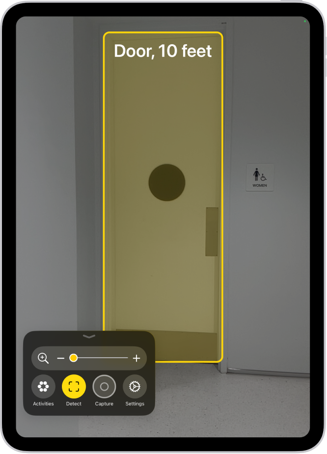 The Magnifier app is open and a door is being detected. A description shows how far away the door is.