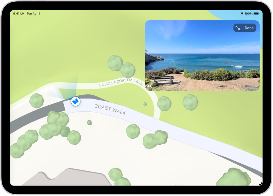 A moveable, 360-degree panoramic view appears above a map of the area marked in the Maps app. The Look Around icon overlaid on the map points in the direction of the view.