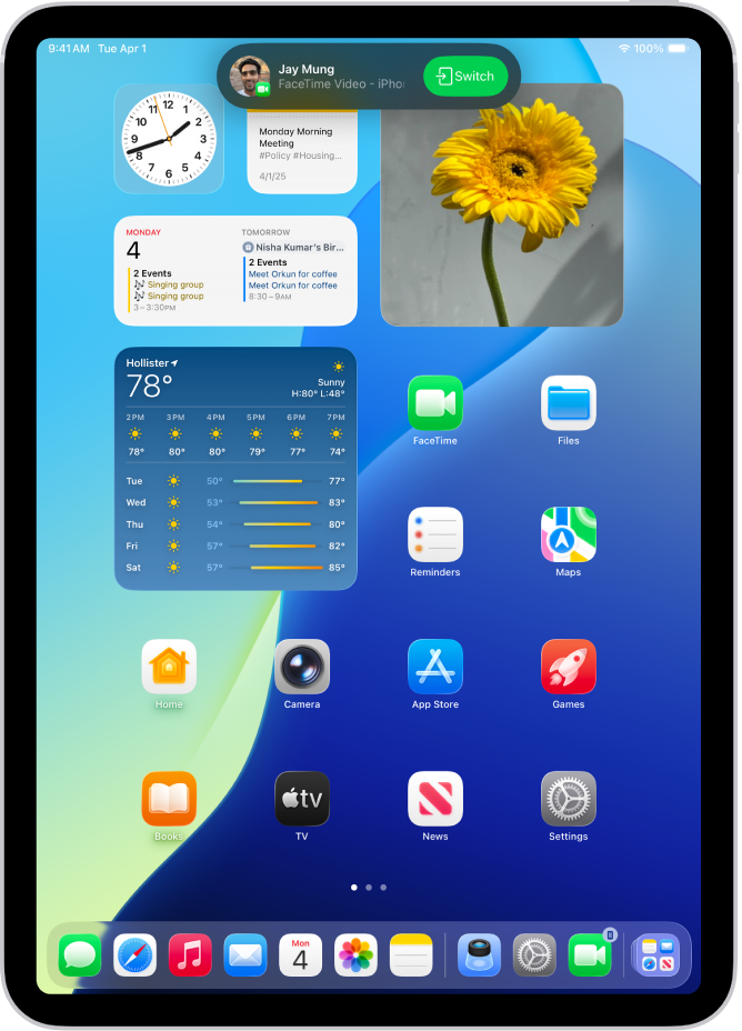 The iPad Home Screen showing a FaceTime video call notification from an iPhone at the top. Tap Switch to move the call to your iPad.