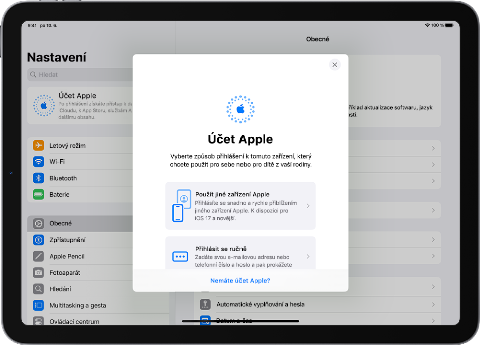 Obrazovka Nastavení, na které se uprostřed zobrazuje dialogové okno přihlášení k účtu Apple