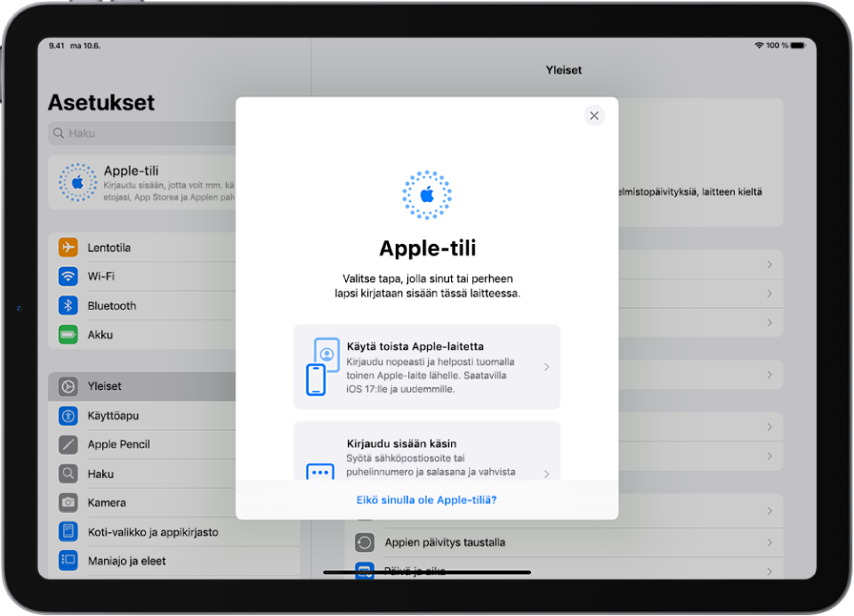 Asetukset-näyttö ja Apple-tilin kirjautumisikkuna näytön keskellä.