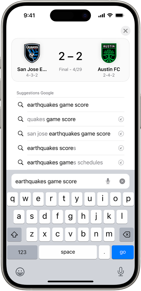 Un écran de recherche Safari, avec le clavier à l’écran en bas de l’écran. Au-dessus du clavier, le champ de recherche contient le texte « earthquakes game score ».
