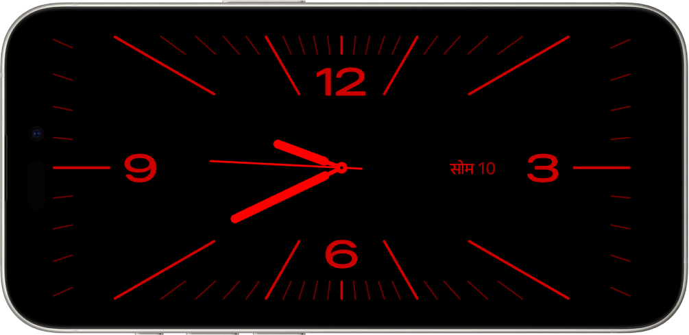 कम ऐम्बिएंट लाइट में स्टैंडबाय मोड में iPhone, लाल रंग के साथ घड़ी और कैलेंडर विजेट प्रदर्शित करता है।