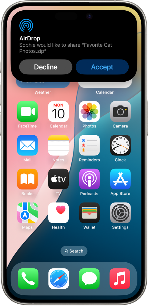 മുകളിൽ ഒരു AirDrop സന്ദേശം കാണിക്കുന്ന ഒരു iPhone ഹോം സ്ക്രീൻ.