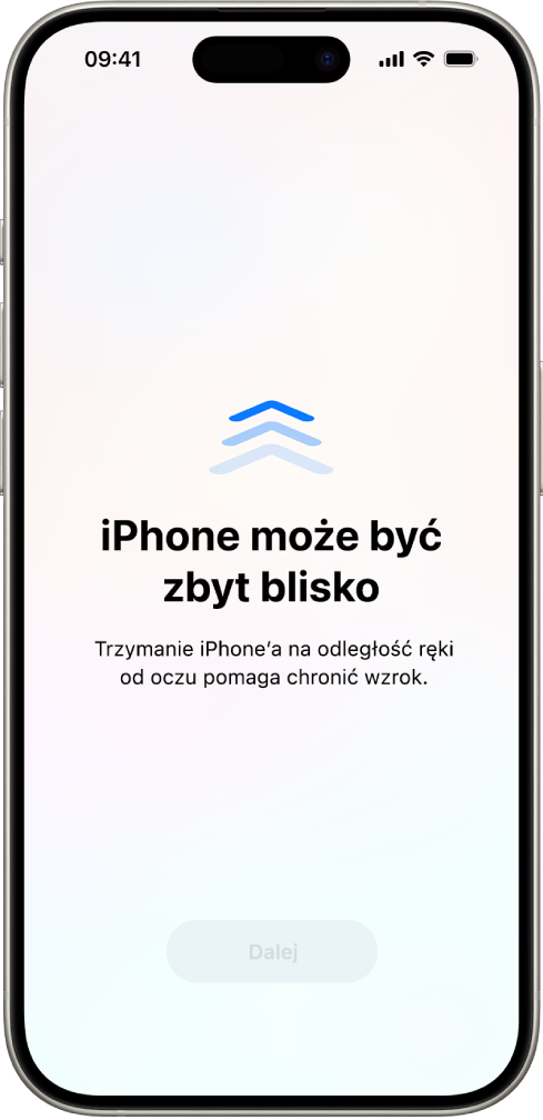 Ekran z ostrzeżeniem, że trzymasz iPhone’a zbyt blisko i należy odsunąć go od oczu, aby chronić swój wzrok. Ostrzeżenie zasłania ekran i uniemożliwia dalsze korzystanie z urządzenia. Na dole widoczny jest przycisk Dalej, który staje się aktywny po odsunięciu iPhone’a na bezpieczną odległość od oczu.