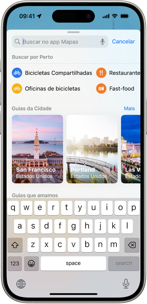 App Mapas mostrando o campo de busca, categorias de serviços por perto e guias de cidades. Na parte inferior da tela encontra-se o teclado do iPhone.