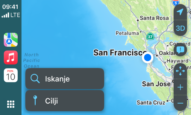 Zaslon CarPlay, ki prikazuje zemljevid San Francisca. Na desni so gumbi za lokacijo, 3D, prijava nevarne okoliščine in povečavo. Na dnu so gumbi Iskanje in Cilj.