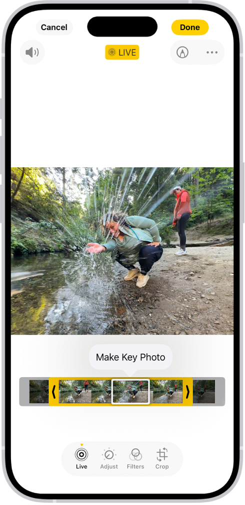 A Live Photo is open in the Photos app. Beneath the photo is the frame viewer with the Make Key Photo button active. On either end of the frame viewer are two arrows that allow you to trim the Live Photo. At the bottom of the screen are the Live, Adjust, Filters, and Crop buttons. The Live button is selected.