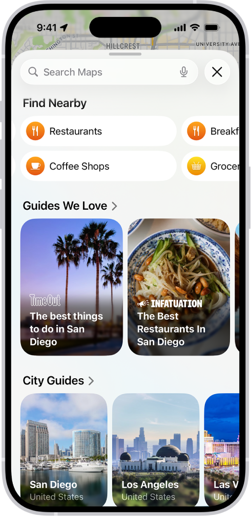 The Maps app showing the search field, categories for nearby services, and city guides. In the bottom part of the screen is the iPhone onscreen keyboard.