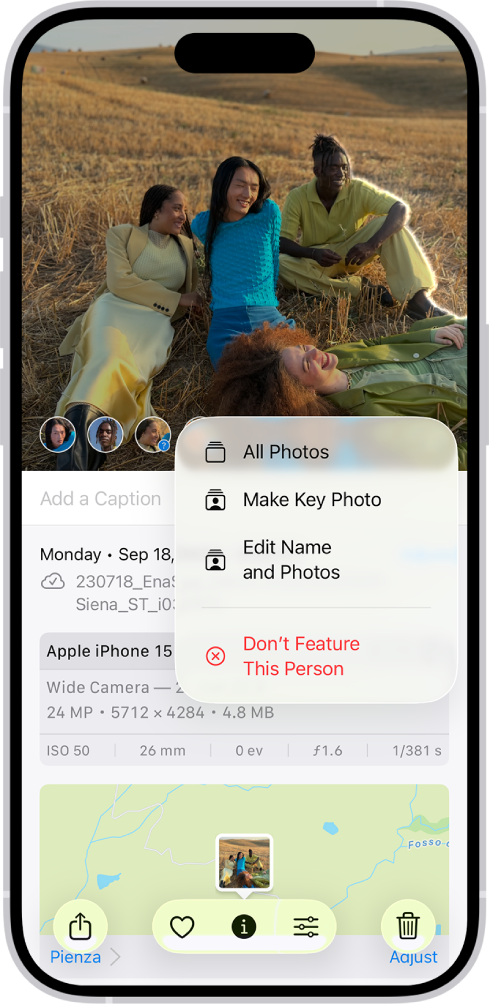 The top half of the iPhone screen shows a photo open in the Photos app. In the bottom-left corner of the photo are the faces of the people that appear in the photo. One of the faces has a question mark next to it. A menu of options includes, from top to bottom, All Photos, Make Key Photo, Edit Name and Photos, and Don’t Feature This Person.