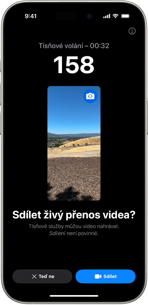 Obrazovka živého přenosu videa funkcí Tíseň SOS zobrazující tísňové volání (v ČR například na linku 112) s náhledem videa uprostřed. Dole jsou tlačítka Teď ne a Sdílet video