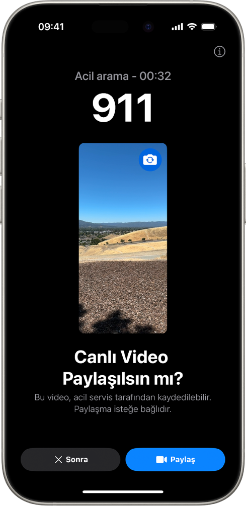 Ortada bir video önizlemesi ile bir 112 acil telefon aramasını gösteren Acil SOS Canlı Video ekranı. En altta Şimdi Değil ve Videoyu Paylaş düğmeleri var.