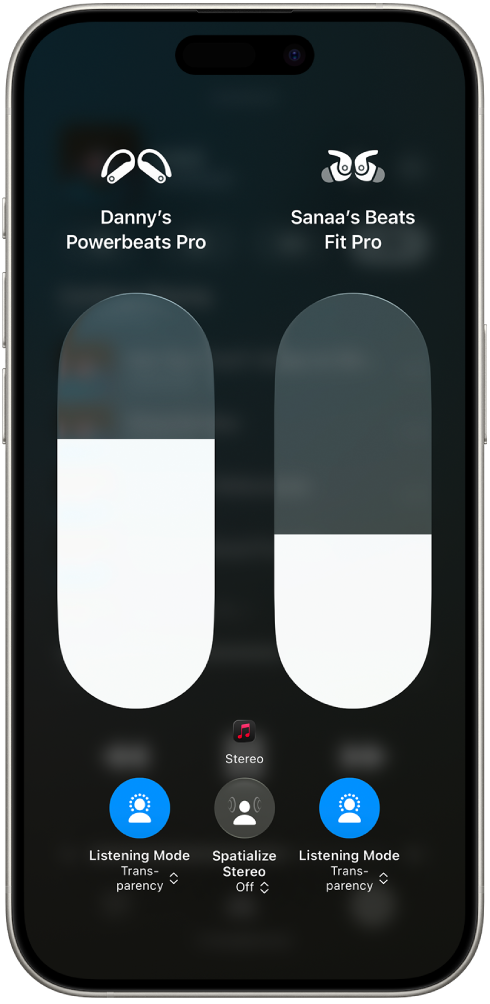 The volume screen in Control Center showing the volume level for two pairs of Beats. Below the volume indicator on the left is the Listening Mode icon, showing that Transparency is on. Below the volume indicator on the right is the Listening Mode icon, also showing that Transparency is on.
