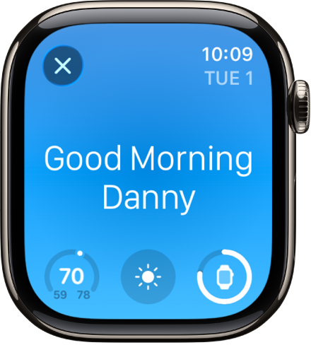Apple Watch showing the wake up screen. The words Good Morning appear at the top. The temperature, weather condition, and battery level are below.
