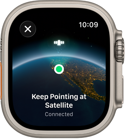 A screen showing a satellite icon over a curved view of Earth, a green connection indicator, and “Keep Pointing at Satellite” text.