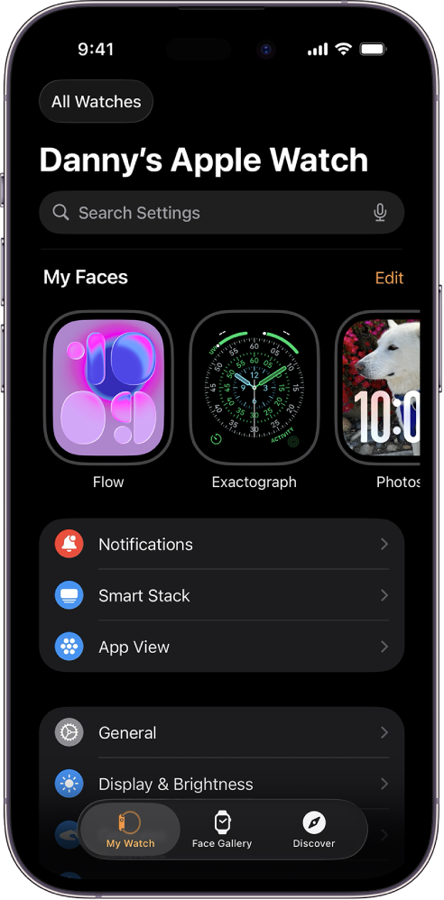 The Apple Watch app on iPhone open to the My Watch screen, which shows your watch faces near the top and settings below. There are three tabs at the bottom of the Apple Watch app screen: the left tab is My Watch, where you go for Apple Watch settings; next is the Face Gallery, where you can explore available watch faces and complications; then Discover, where you can learn more about Apple Watch.