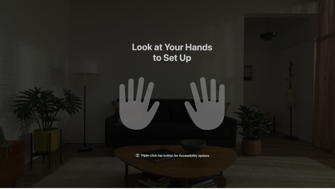 Hand setup on Apple Vision Pro, instructing the user to look at their hands in front of them.