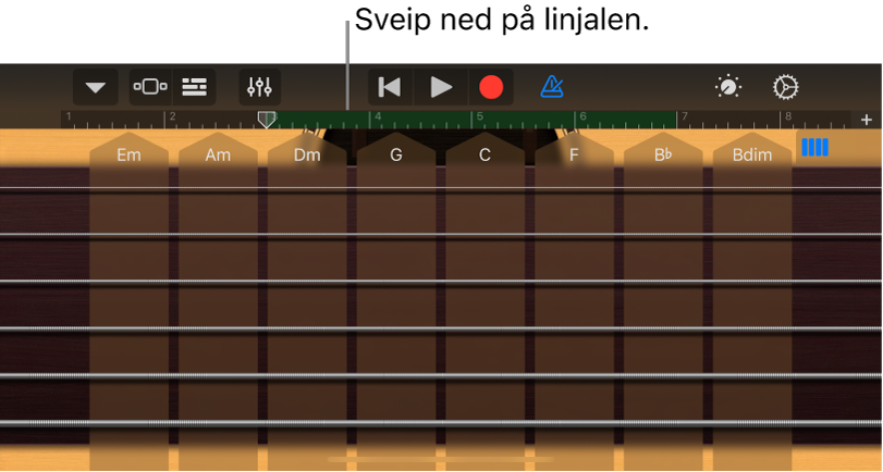 Trykk og hold på linjalen, og dra nedover