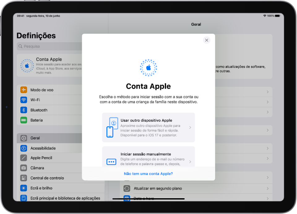 O ecrã Definições, com a caixa de diálogo de início de sessão na conta Apple no meio do ecrã.