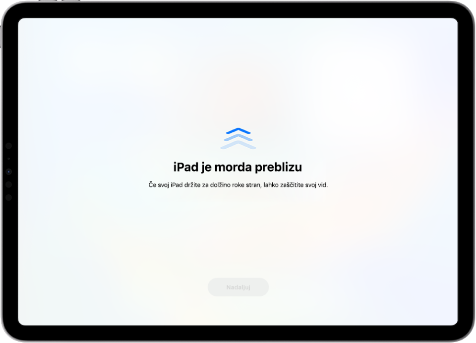 Opozorilo na zaslonu, da iPad držite preblizu in da ga morate odmakniti, da zaščitite svoj vid. Opozorilo prekrije zaslon in vam prepreči nadaljevanje. Na voljo je gumb Nadaljuj, ki postane aktiven, ko premaknete iPad na varno razdaljo.