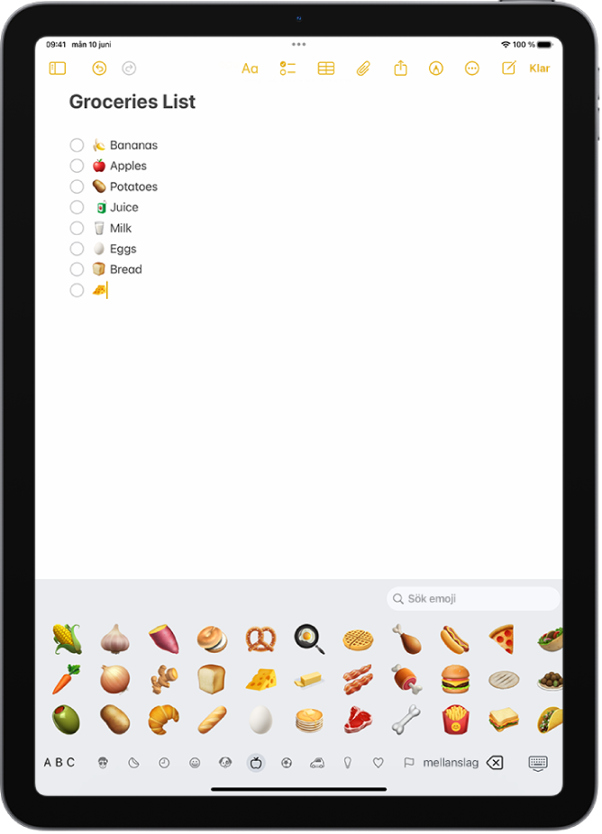 En anteckning är öppen i appen Anteckningar upptill på skärmen och emojitangentbordet är öppet nedtill på skärmen.