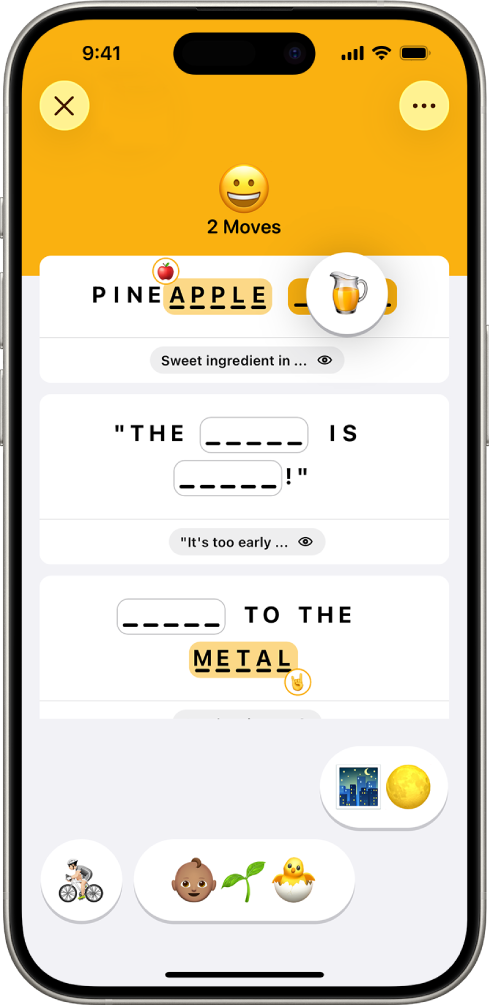The Emoji game, showing the number of moves, two emoji placed as answers, and one about to be placed in an unanswered spot.