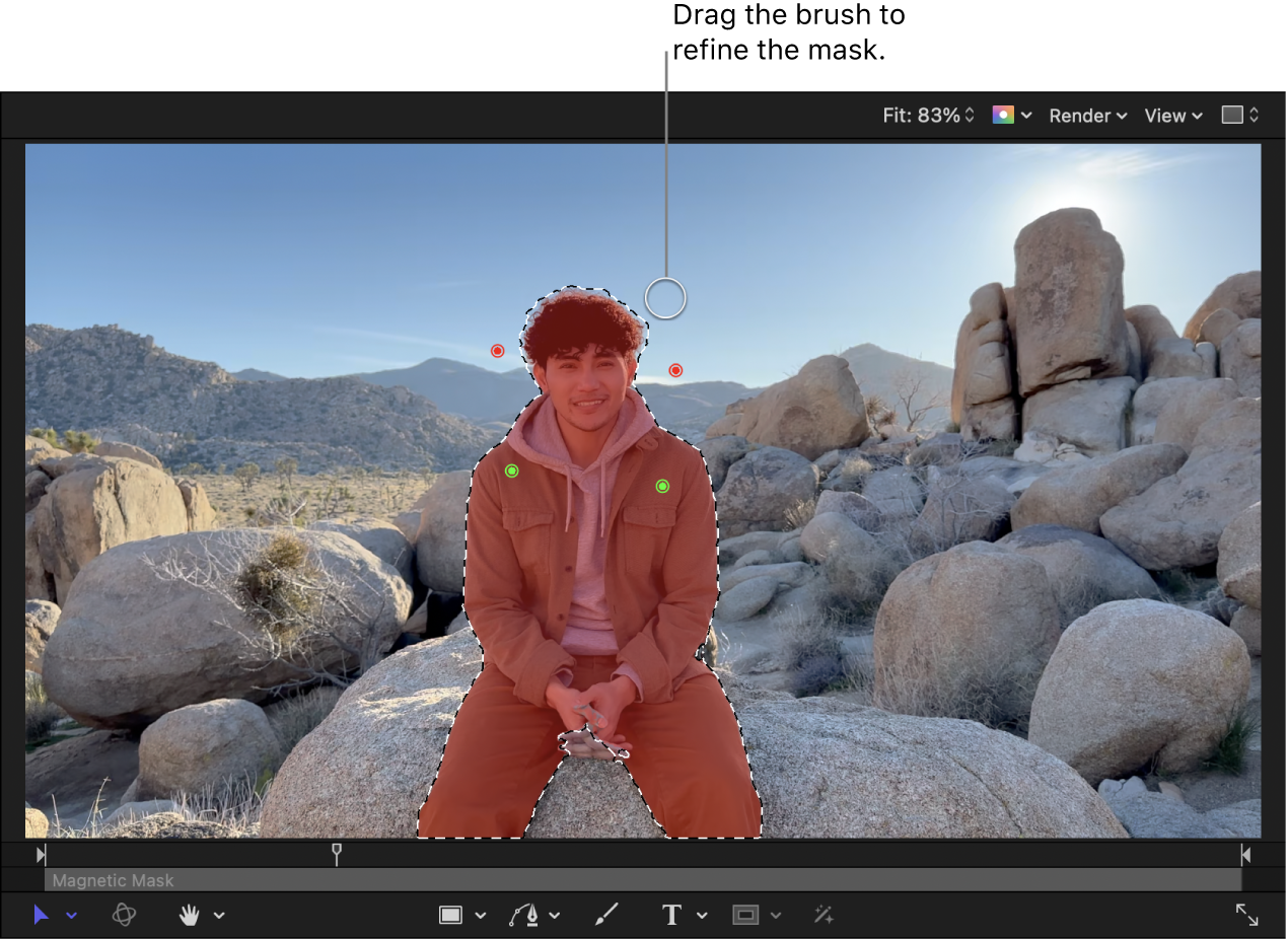 The canvas showing a Magnetic Mask applied to a person in the foreground and green and red control points for adding and removing mask areas. The Remove brush is selected.