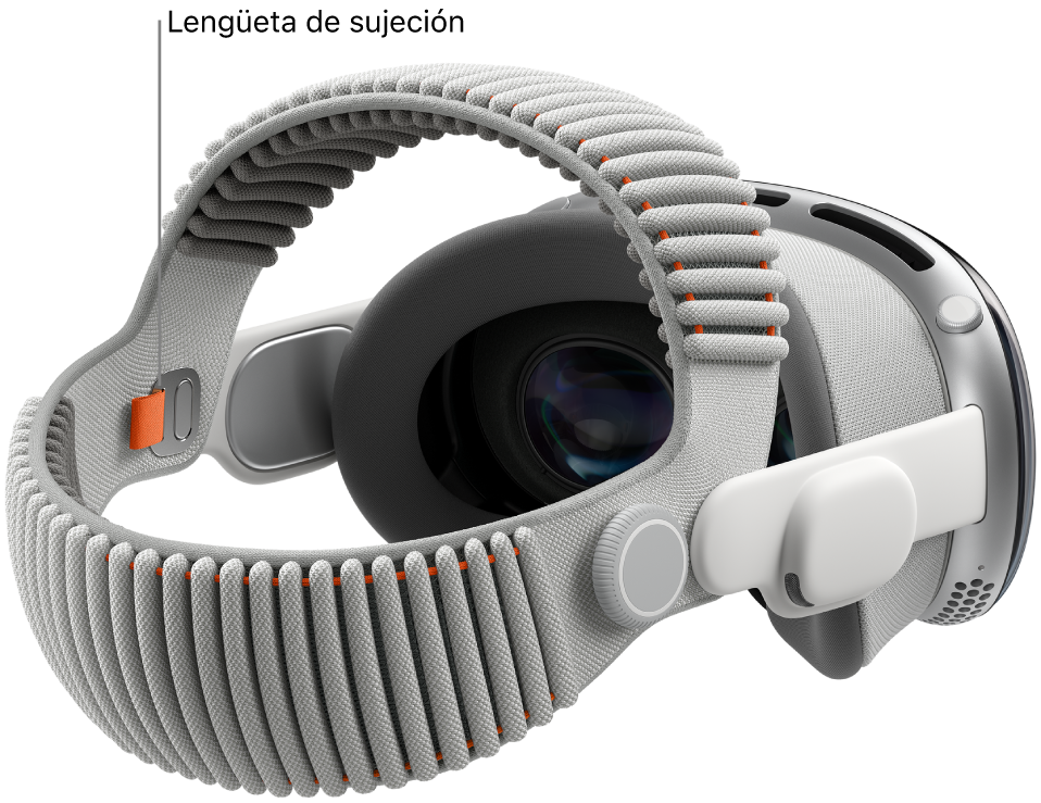 Apple Vision Pro con la banda Dual Knit colocada. Se ve una lengüeta de sujeción de color naranja en la cara interna de la banda Dual Knit.
