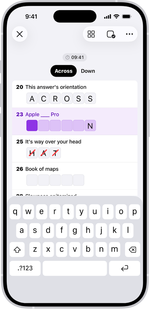 A partially filled crossword puzzle in list view, and a keyboard open at the bottom.
