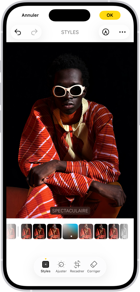 L’écran Modifier avec une photo au centre. En bas de l’écran, de gauche à droite, se trouvent les boutons Styles, Ajuster, Recadrer et Corriger. Le bouton Styles est sélectionné. Sous la photo figurent les différentes options de style. L’option Spectaculaire est sélectionnée. Le bouton Annuler se trouve en haut à gauche de l’écran et le bouton OK en haut à droite.