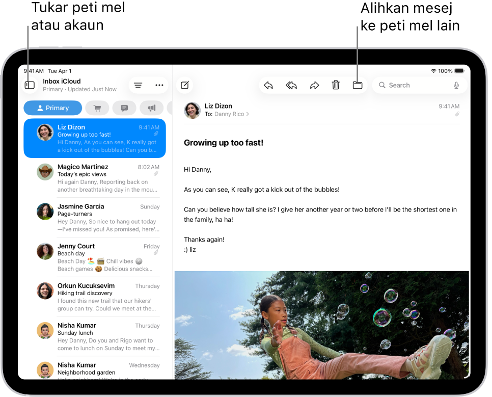 Peti Masuk Mail, dengan senarai e-mel di bahagian kiri dan e-mel terbuka di bahagian kanan.